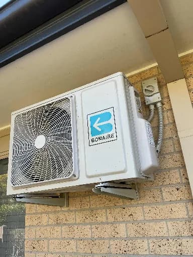 Outdoor unit on a brick wall