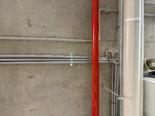 Conduit run along a wall